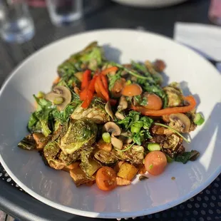 Veganized Brussels sprout hash. No eggs or Hollandaise, added arugula, cherry tomatoes, asparagus, and mushrooms.