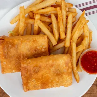 a plate of french fries and dipping sauce