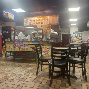 The front of the restaurant, not tiny just comfortable.