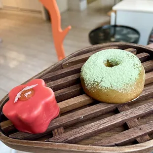 Matcha donut with matcha ice cream filling and marshmallow covered in white chocolate and sakura