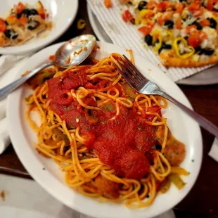 Uncle spaghetti special- pasta topped with marinara, sausage, and peppers. Half size.