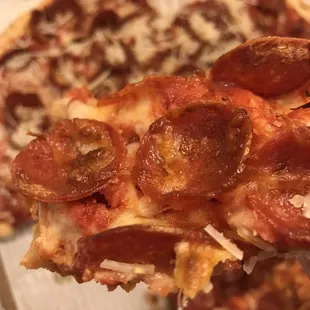 a slice of pepperoni pizza