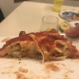 a half eaten slice of pizza