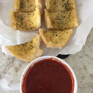Garlic bread and marinara sauce.