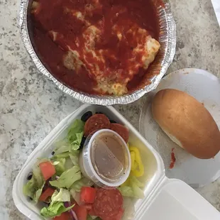 Lasagna with salad and small bread