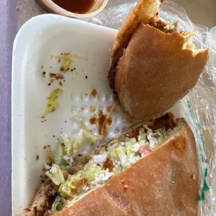 Milanesa torta with everything and red spicy salsa