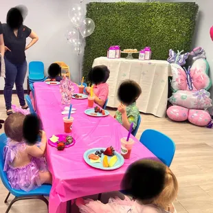 Kids party table and dessert table with grass backdrop