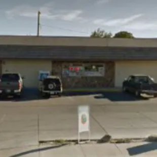 a parking lot with cars parked in front of it