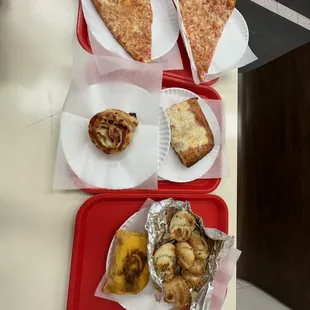 Pizza, scilain pizza, pepperoni roll, gralic knots, and beef patty