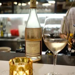 a glass of wine and a bottle of wine