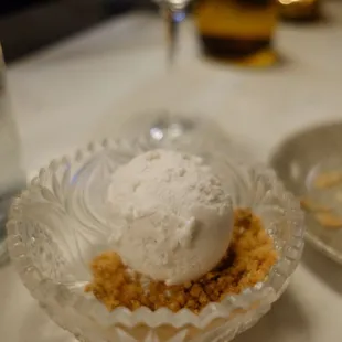 a dessert in a glass bowl on a table