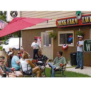 a crowd of people sitting outside