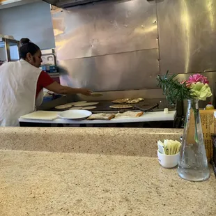 a man preparing food in the kitchen