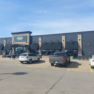 parking lot with cars in front