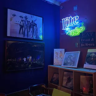 a neon sign in the corner of the room