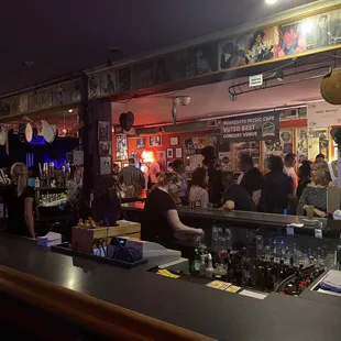a crowd of people at the bar