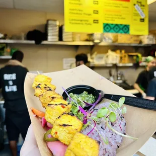 Lemongrass Turmeric Tofu! Comes with purple sticky rice and pickled veggies. Best food I've eaten at the fair.