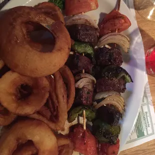 Beef kabobs.... didn't taste or cut like filet. Onions overpowering.  Onion rings were store-bought, nothing special.