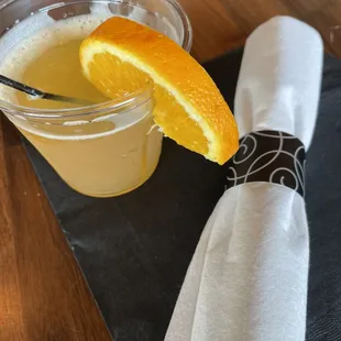 a drink and napkin on a table