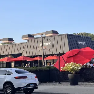 a car parked in front of a restaurant