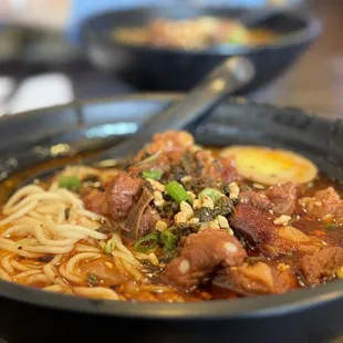  bowl of noodles with meat and vegetables