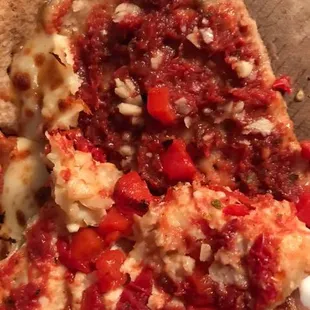 Coated in raw garlic, so overpowering and definitely not roasted. "sun-dried" tomatoes, are just regular tomatoes.