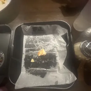 a piece of chocolate cake on a tray