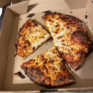 Burnt mini cheese pizza from Minsky's.