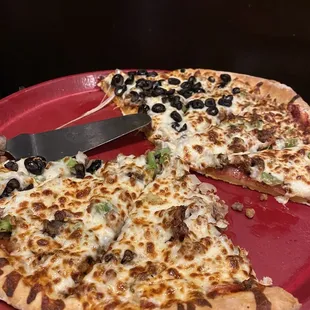 Jumbo combo pizza with pepperoni, sausage, hamburger, onion, green pepper and olives