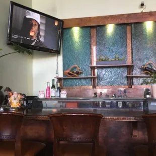 bar a beautiful water fall behind glass!