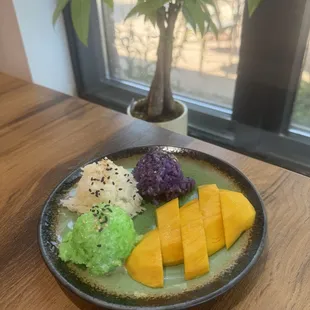 Tri color Thai sticky rice coconut mango.