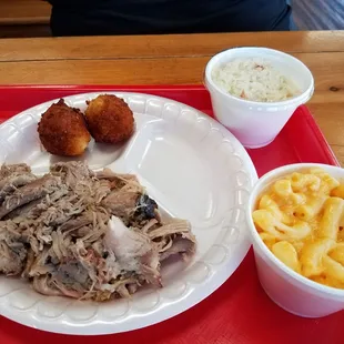 Pork bbq, mac and cheese, and white slaw with hush puppies.