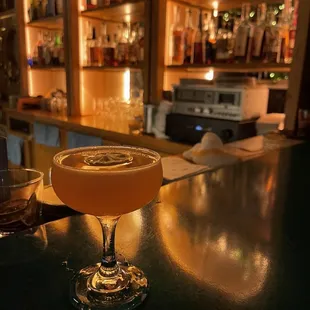 a cocktail sitting on a bar
