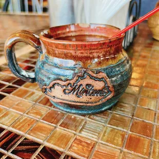 a mug with a spoon in it