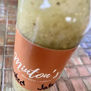 a bottle of green liquid