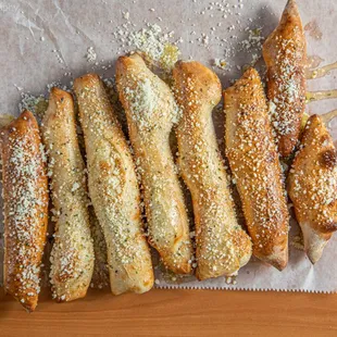 a variety of breadsticks on wax paper