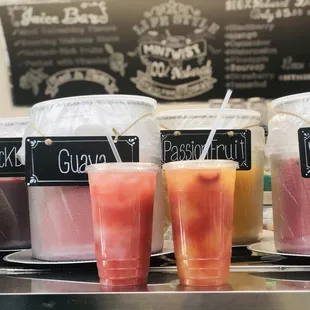 a variety of drinks on a counter
