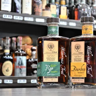 two bottles of liquor on a counter