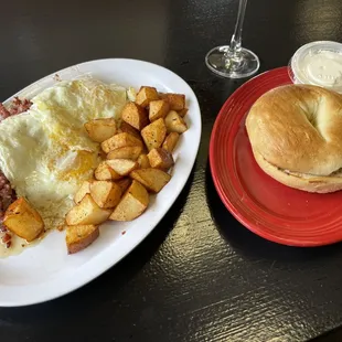 Corned beef hash and eggs and a plain bagel