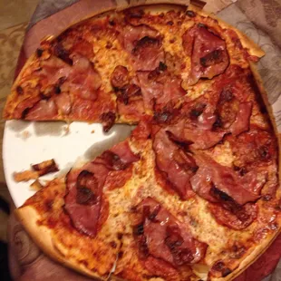 Love thin crust large with pepperoni, Canadian bacon and breakfast bacon