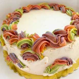 Natural dye rainbow vanilla buttercream cake with strawberries