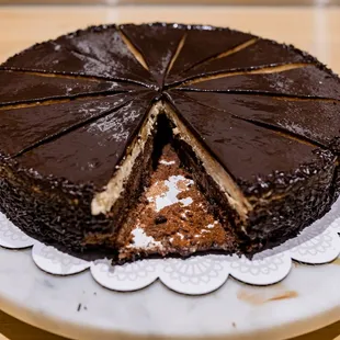a chocolate cake with a slice taken out of it