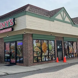 Outside of the restaurant, post Covid.  Some outside seating. Chairs inside for while you wait.