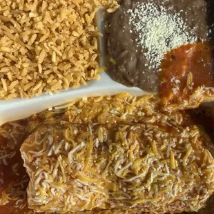 Wet Veggie Burrito Comes with Beans and rice. Inside burrito is large lightly cooked strips of bell pepper and onions.