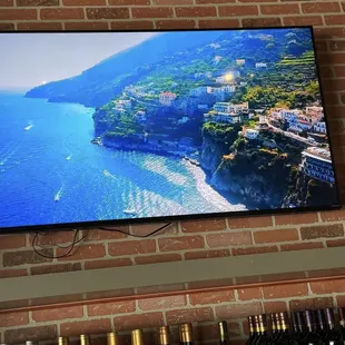 The bar and tv that captures the most beautiful pictures of Italy.