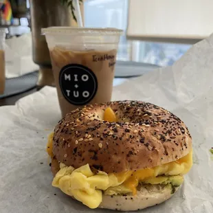 Iced honey lavender latte, everything bagel with egg, cheese, and avocado