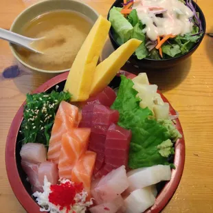 Chirashi sushi, freshly cut assorted raw fish over rice, served with soup and salad. $15.95 for lunch, $16.95 for dinner.
