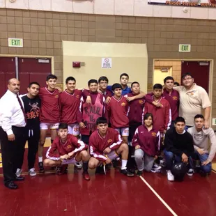 Team picture with wrestling coaches