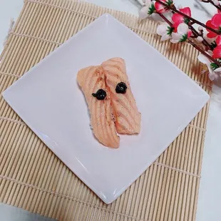 a close up of a plate of sushi