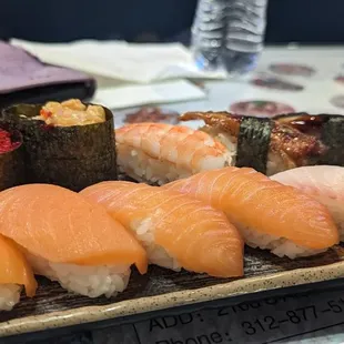 Nigiri: (front, left to right) smoked salmon, salmon, red snapper; (back, left to right) red tomago, spicy scallop, shrimp, eel